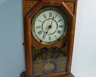 Lot 36:  C/1880 Oak Seth Thomas Library Clock, gallery top, signed dial, 8 day time and strike, orig. pendulum and key, 11" x 5" x 19" h.  Cond: Minor wear, running when photographed.    Est. $100 - 200.