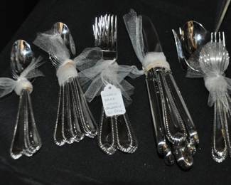 Classic Bead Glossy Stainless Steel Flatware by Lenox, 4 Piece Place Setting for 6 with Serving Pieces, ($95).