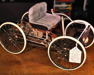 Franklin Mint “Ford’s First Car, 1896” Quadricycle Precision Model 1.6 Scale Die-cast, 13”W x 7” H x 6 1/2” D ($125)