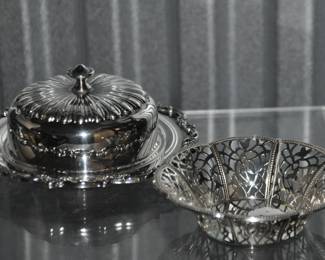 Admire the Intricate Design of this Three-Piece Silver Plate Butter Dish, it is Sure to Add A Touch of Class to Any Tabletop. ($30) And To the Right is a Silver Plate Lace Cut Trinket Dish, ($15).