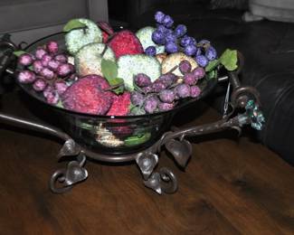Heavy Green Blown Glass Centerpiece Bowl on a Bronze Scroll Metal Holder. Holder has 2 Glass Flower Details, 15” W x 9”H x 21” D. ($115) Sorry Fruit not Included.