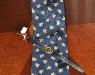 Stunning Brioni Silk Tie ($50) Shown with a Woman’s Movado Museum Watch ($50)