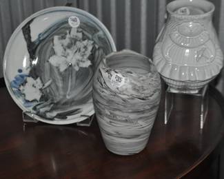 7 1/2” Marbleized Grey Vase Artist Signed M. Waller ($35) Shown with an Artist Signed 8” Glazed Ceramic Decorative Plate ($40) and a Jonathan Adler “Utopia Pleasantly Plump” Cream Stoneware Vase ($45)