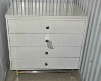 Brand New! Gorgeous Universal Furniture Paradox 4 Drawer Ivory Nightstand with Stone Top and Polished Silver Base, 28W X 18D X 27H. Retail $1215.00. Our Price $650