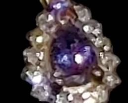 Natural Blue Violet Tanzanite & Diamond Halo Pendant Necklace / Tear Drop Pendant set in 14kt yellow gold
( I'll post some better pics) 