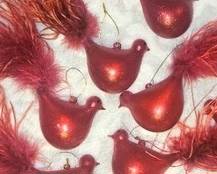 Hand blown red birds with feathers