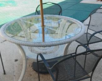 Outdoor table chairs and umbrella