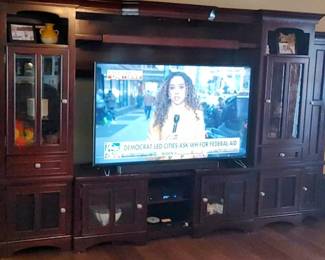 Large mahogany entertainment center made for modern TVs. ( comes apart in there sections) 