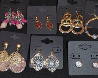 Many sets of matching earrings