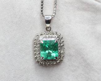 NATURAL EMERALD RING SET IN SOLID PT900 PLATINUM WITH DIAMOND HALO 2.06CTW, 7.7 GRAMS, SIZE 16 INCHES
