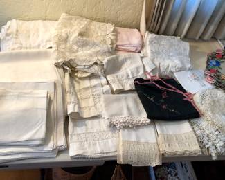 Lots of vintage linens: damask tablecloths & napkins, pillow cases, doilies & more