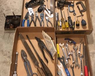 Assorted hand tools: pliers, wrenches, screwdrivers, clamps, planes, oil cans