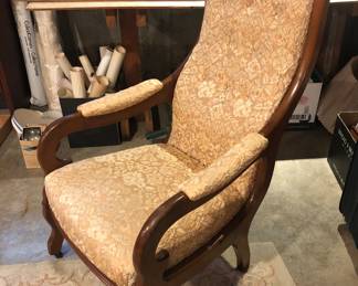 Vintage chair with carved fruit at top