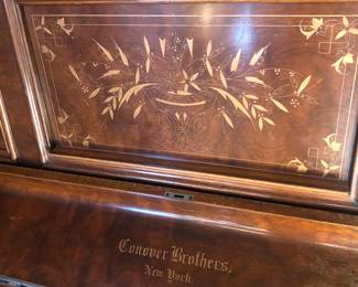 Lovely burlwood cabinet with pretty carved details. Has nice tone & all keys work.