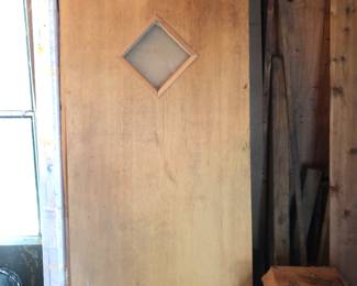 Mid Century door, unfinished luan with diamond shape glass window. 