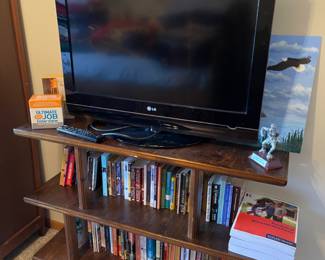 LG 32” TV, SHELVING AND BOOKS