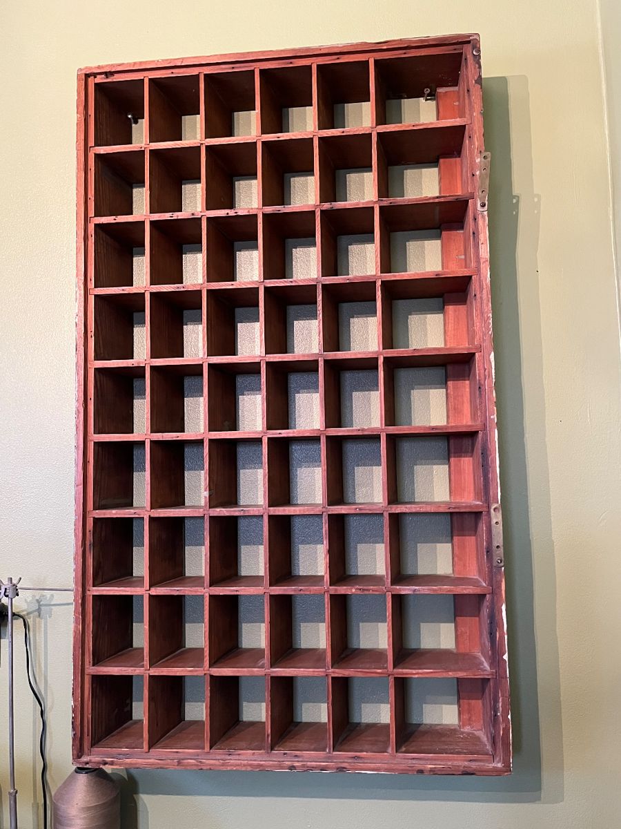 Pigeonhole shelf, most likely a hotel key shelf