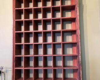 Pigeonhole shelf, most likely a hotel key shelf