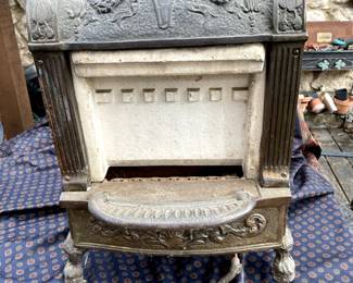 1920s era cast iron and ceramic gas furnace in great condition.  You will see many of these in this neighborhood in front yards with ceramic tile on the face and used as address markers.  Seller could help you with this if that is something you would like to do.