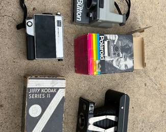 Collection of old cameras with boxes
