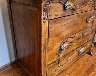 Unique wood cabinet with leaf “pulls” and metal bird on a branch lamp