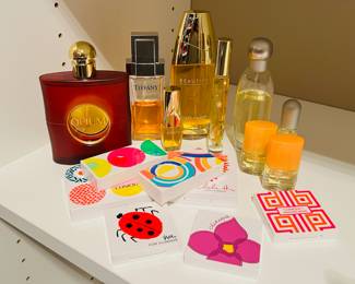 Women’s perfume & cosmetics including Tiffany & Co. TIFFANY Classic Eau De Parfum, Opium by Yves Saint Laurent, Estée Lauder’s Beautiful/Pleasures/Happy and more