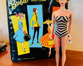 1961 Bubble Cut Titian Red Hair Barbie with original striped swimsuit, Barbie Doll Case and 10 outfits.  Outfits include ‘Evening Splendor’, ‘Friday Night Date Night’, ‘Solo In The Spotlight’, ‘Winter Holiday’, ‘Nighty Negligee’ and more.  There are a few additional accessories & shoes.  THIS WILL BE SOLD AS ONE LARGE COLLECTION. 