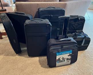 Like new Tumi Luggage, Briggs & Riley carry-on and New With Tags Belkin Notebook Trolley