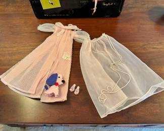 1961 Bubble Cut Titian Red Hair Barbie with original striped swimsuit, Barbie Doll Case and 10 outfits.  Outfits include ‘Evening Splendor’, ‘Friday Night Date Night’, ‘Solo In The Spotlight’, ‘Winter Holiday’, ‘Nighty Negligee’ and more.  There are a few additional accessories & shoes.  THIS WILL BE SOLD AS ONE LARGE COLLECTION. 