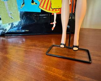 1961 Bubble Cut Titian Red Hair Barbie with original striped swimsuit, Barbie Doll Case and 10 outfits.  Outfits include ‘Evening Splendor’, ‘Friday Night Date Night’, ‘Solo In The Spotlight’, ‘Winter Holiday’, ‘Nighty Negligee’ and more.  There are a few additional accessories & shoes.  THIS WILL BE SOLD AS ONE LARGE COLLECTION. 