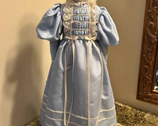Antique 21” porcelain doll on stand
