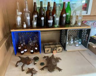 Antique and vintage bottles guarded by horny toads!