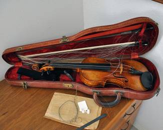 There is an appraisal for this violin and bow that was done in 1984.  It hasn't been out of the case since then.
