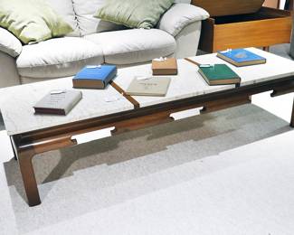 Marble table with group of collectible books