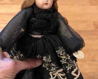 Pretty old doll with gorgeous old dress