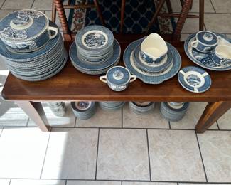 Blue and white dishes on dining table bench