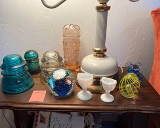 Insulators, milk glass eye cups, Fenton vase, Murano paperweights 