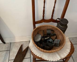 Old cookie cutters in basket, boot jack, antique maple chair
