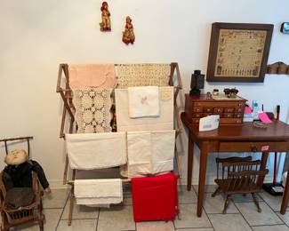Dining room: spice rack, linens,baby doll stroller, hand made doll, desk, magazine rack, etc