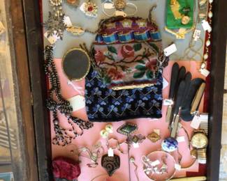 Jewelry, old beaded bags, ebony handle manicure set, watches, some of the pocket knives