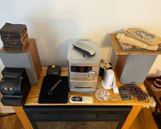 Uncle Sam cash coin bank, old books, Sony MP3 radio/ CD player, jewelry 