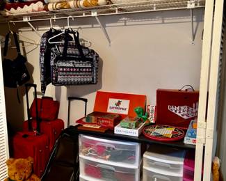 Closet with games, toys, luggage, linens, etc