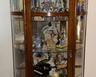 Curio Cabinet is for sale and everything in it.