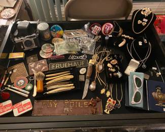 Antique metal signs, vintage lighters, vintage jewelry, vintage sunglasses, vintage perfume, 