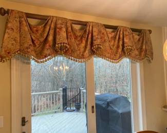 Scalloped tassel fringe valance with rod over a six foot slider