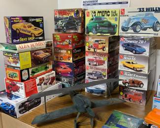 Vintage model cars - Boxes and displays as well. Mini brass cannons.