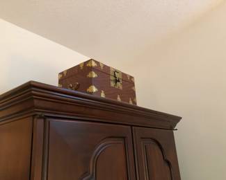Beautiful Asian Box w/Brass Accents w/shelf inside sitting upon the Master Bedrooms Armoire