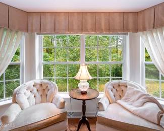 Lovely Velvet Chairs in the Master Bedroom w/another Scalloped Side Table and a Beautiful Brass & Glass Lamp upon it