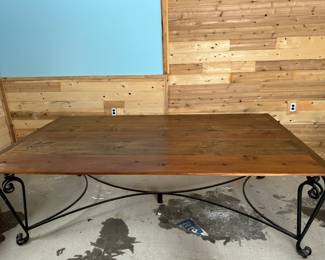 Hand crafted dining room table with wrought iron legs