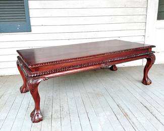 ANTIQUE MAHOGANY CARVED BALL AND CLAW FOOT COFFEE TABLE